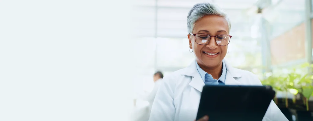 Clinician reviewing patient data on a tablet