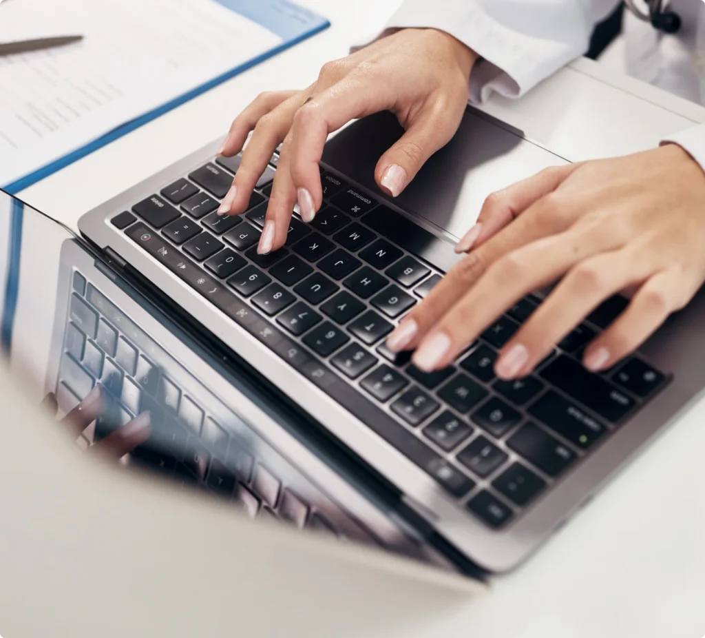 Clinician reviewing longitudinal patient data at a workstation